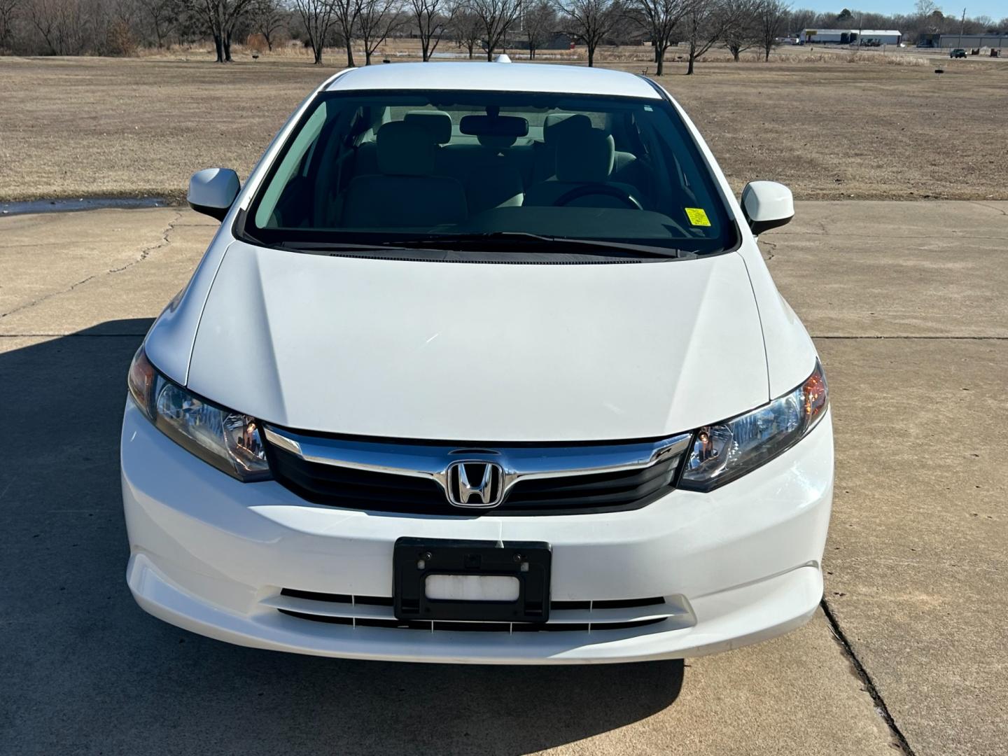 2012 White /Gray Honda Civic CNG Sedan 5-Speed AT (19XFB5F58CE) with an 1.8L L4 SOHC 16V CNG engine, 5-Speed Automatic transmission, located at 17760 Hwy 62, Morris, OK, 74445, (918) 733-4887, 35.609104, -95.877060 - 2012 HONDA CIVIC 1.8L FWD DEDICATED CNG (COMPRESSED NATURAL GAS) VEHICLE. FEATURES REMOTE KEYLESS ENTRY, POWER LOCKS, POWER WINDOWS, POWER MIRRORS, MANUEL SEATS, AM/FM RADIO, CD PLAYER, USB, AUX, BLUETOOTH FOR HANDS-FREE CALLING, 12V POWER OUTLET, CRUISE CONTROL, TRACTION CONTROL, CLOTH SEATS, 195/6 - Photo#1